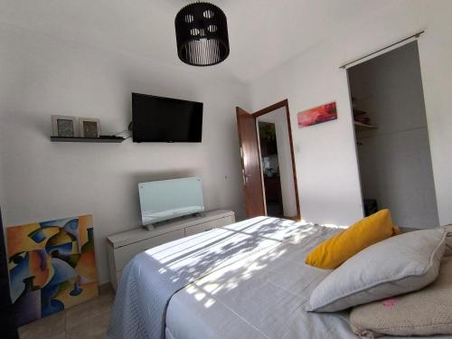 Et tv og/eller underholdning på Casa de playa en zona sur, cerca del mar