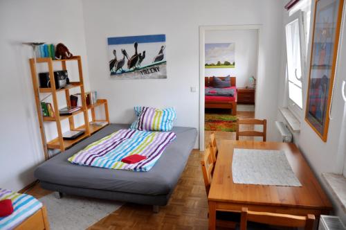 a living room with a couch and a table at 2-Zimmer-Appartment in Troisdorf Sieglar in Troisdorf