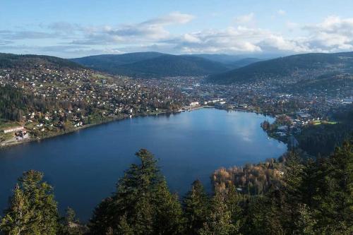 an aerial view of a lake in the mountains at Studio cosy ambiance vosgienne à 20 mn de Gerardmer in Lépanges-sur-Vologne