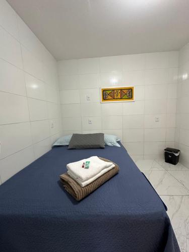 Postel nebo postele na pokoji v ubytování Cantinho Aconchegante- Quarto 03 Família - com AR