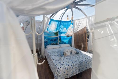 a bedroom with a bed with a teddy bear on it at Oasi della pace in Bisceglie