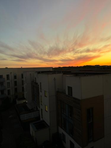 a sunset from the rooftop of a building at Dublin Private Room in Dublin