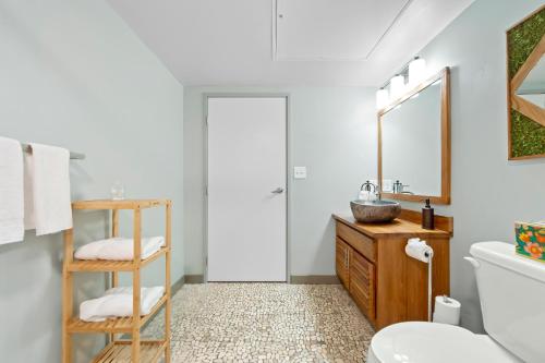 a bathroom with a sink and a mirror at 107-Cozy Loft Haven Parking Fast Wi-Fi Cafe in Cleveland