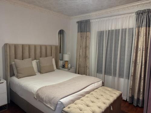Postel nebo postele na pokoji v ubytování HomelyVest Guesthouse