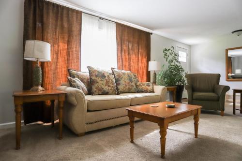 a living room with a couch and a coffee table at River's Edge Hot tub dock trout fishing in Kingsley