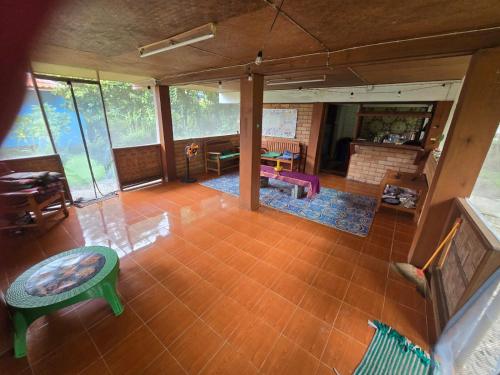 an aerial view of a living room with tables and chairs at Sunny family in Pai