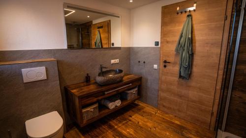 a bathroom with a sink and a shower at Tiroler Alpblick Appartements in Ehrwald