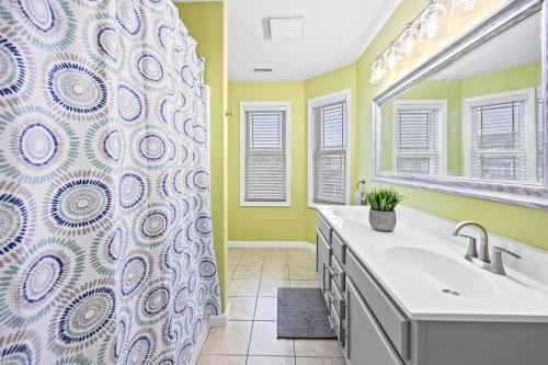 a bathroom with a sink and a shower curtain at Beach Bliss in Wildwood Crest in Wildwood Crest