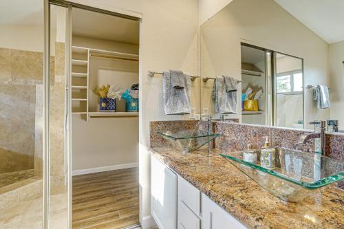 a bathroom with two sinks and a shower at Hot Tub and Patio Family Gem in Avondale in Avondale