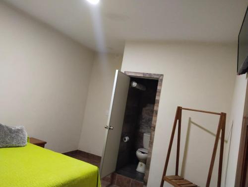 Postel nebo postele na pokoji v ubytování Hotel Hacienda Huasteca