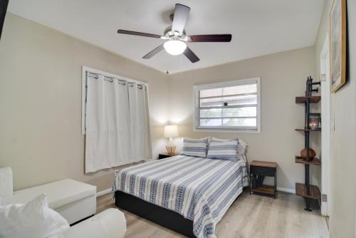 a bedroom with a bed and a ceiling fan at 13 Mi to Busch Gardens Tampa Gem with Grill and Yard in Tampa