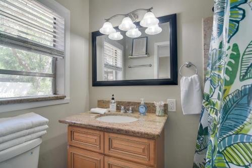 a bathroom with a sink and a mirror at 13 Mi to Busch Gardens Tampa Gem with Grill and Yard in Tampa