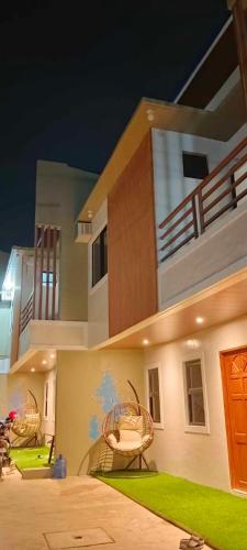 a house with a wicker basket on the side of it at BALAI MALINAWON - Balai 3 in General Luna