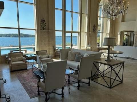 a large room with chairs and tables in a building at Lakeside Grande Villa in Alexander City