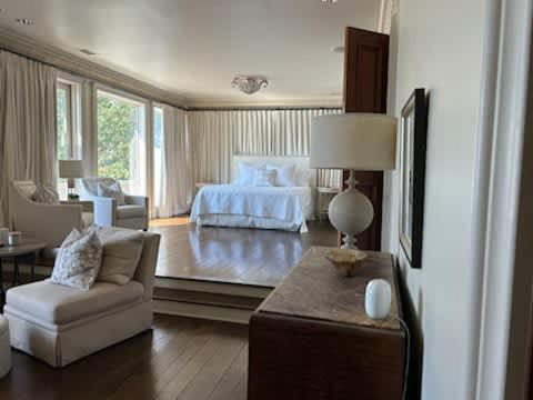 a large room with a bed and a living room at Lakeside Grande Villa in Alexander City