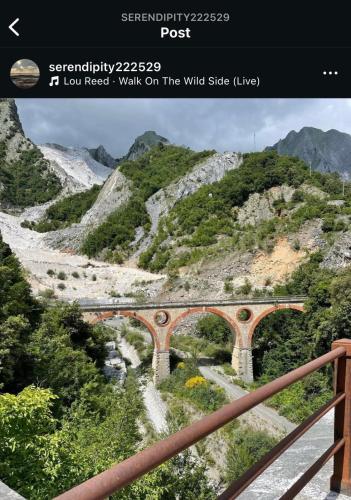a view of a bridge over a mountain road at Camera matrimoniale in Carrara