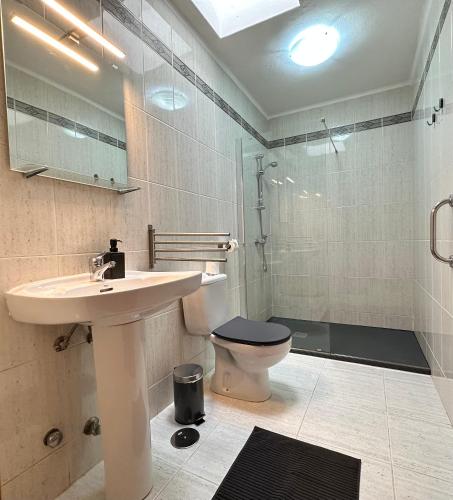 a bathroom with a sink and a toilet at Juwel des Meeres Nudist Place FKK Complejo Nudista - Charco del Palo - in Charco del Palo