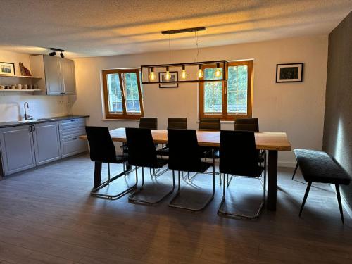 a dining room with a table and chairs at Haus Tauplitz in Tauplitz