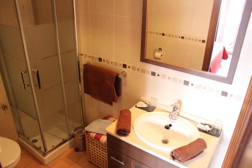 a bathroom with a sink and a shower at Hostal Don Peque Adult Recommended in Nerja