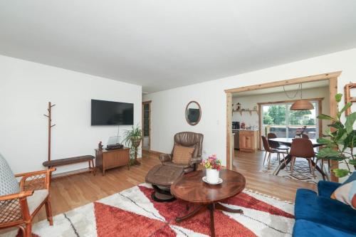 a living room with a couch and a table at Sycamore Shade in Avon