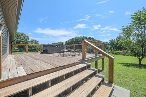 a large deck with a table and chairs on it at Sycamore Shade in Avon