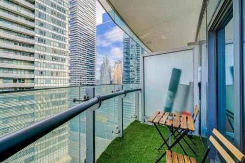 a balcony with a bench and a view of the city at Best Downtown Toronto View! in Toronto
