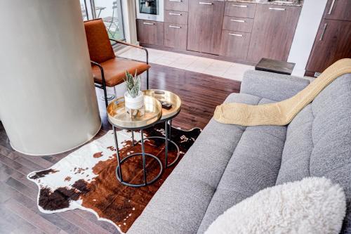 a living room with a couch and a table at Best Downtown Toronto View! in Toronto