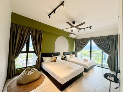 two beds in a bedroom with green walls and windows at K-Avenue by CC Suites 8-10pax ,2 free car park slot in Kota Kinabalu