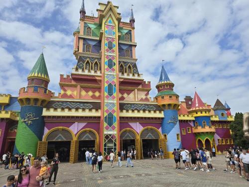 a group of people standing in front of a castle at Apto.napraia BEACH 901 em Piçarras com vista mar in Piçarras