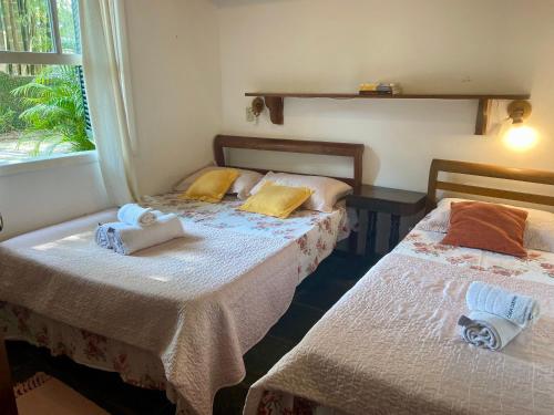 Ένα ή περισσότερα κρεβάτια σε δωμάτιο στο Casa Portador Paraty