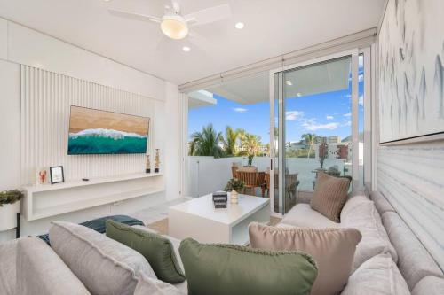 a living room with a couch and a table at New Condo With 2BR in San Lucas in Cabo San Lucas