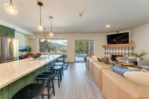 a kitchen and living room with a bar and a couch at Condo in Government Camp in Government Camp