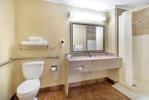 a bathroom with a toilet and a sink at Best Western Gastonia in Gastonia