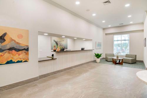 a lobby with a waiting room with a couch and a table at Best Western Plus Crossroads Inn & Suites in Zion Crossroads