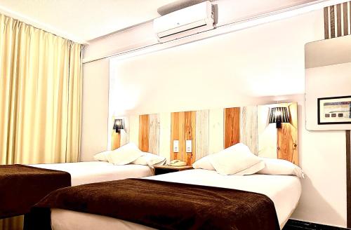 A bed or beds in a room at Arriadh