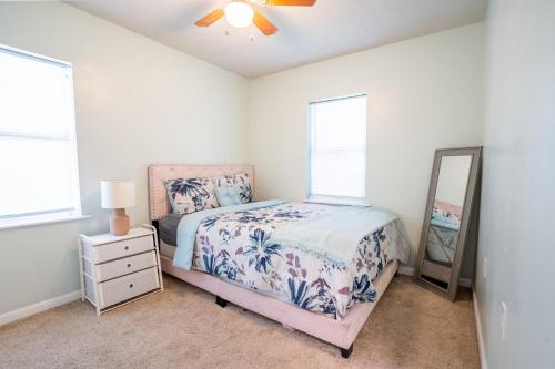 a bedroom with a bed and a mirror at Your home away from home in the heart of the city in Atlanta