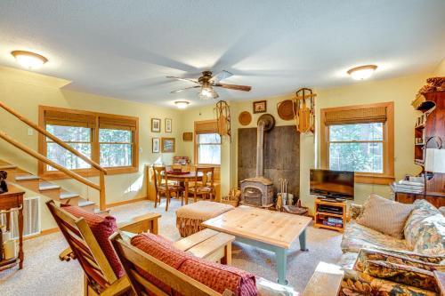 a living room with a couch and a table at 1 Mi to Lake Tahoe Rustic Cabin with Boat Dock in Tahoma