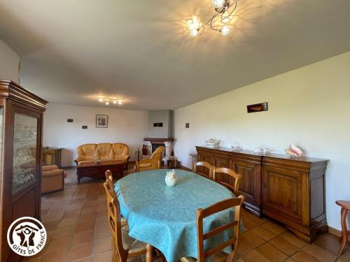 a dining room with a table and chairs at Maison récente avec jardin, 4 chambres, proche mer et commerces à Bouin - FR-1-426-129 in Bouin