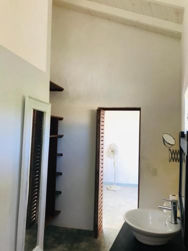 a bathroom with a sink and a mirror at NEW MORINGA in Las Terrenas