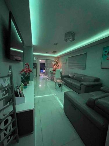 a living room with a couch and a table at Flamingo Paradise in Hialeah