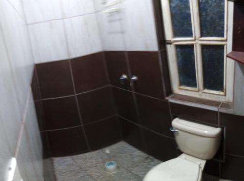 a bathroom with a toilet and a shower at Casa Alvarado in Guanajuato