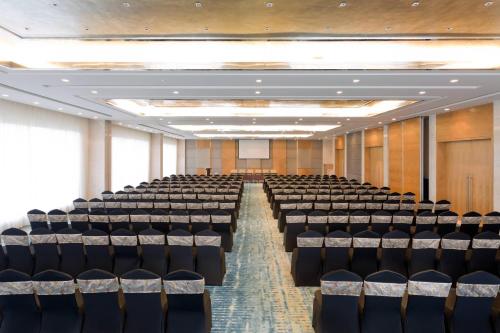 an empty lecture hall with rows of chairs at Fairfield by Marriott Visakhapatnam in Visakhapatnam
