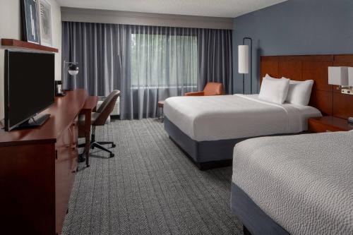 Courtyard by Marriott Covington / Mandevilleにあるテレビまたはエンターテインメントセンター
