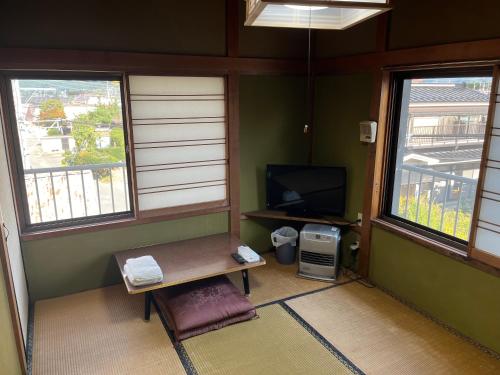TV a/nebo společenská místnost v ubytování ふる里 Mt Fuji Inn Furusato