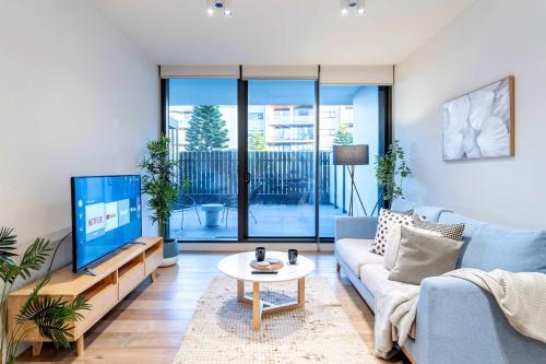 TV a/nebo společenská místnost v ubytování Brilliant Quay Boulevard Apt