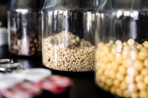 a group of glass jars filled with different types of food at Aura Castle in Picquigny
