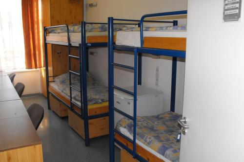 Postel nebo postele na pokoji v ubytování Pannonia Hostel
