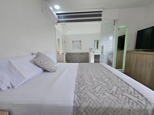 Katil atau katil-katil dalam bilik di Hotel San Jeronimo Armenia