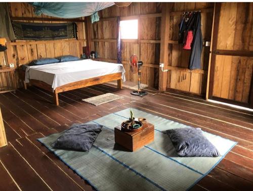 Una cama o camas en una habitación de Dragonfly Guesthouse M'Pai Bay