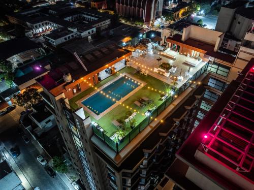 an overhead view of a pool in a city at night at Hotel Real Plaza in San Luis Potosí
